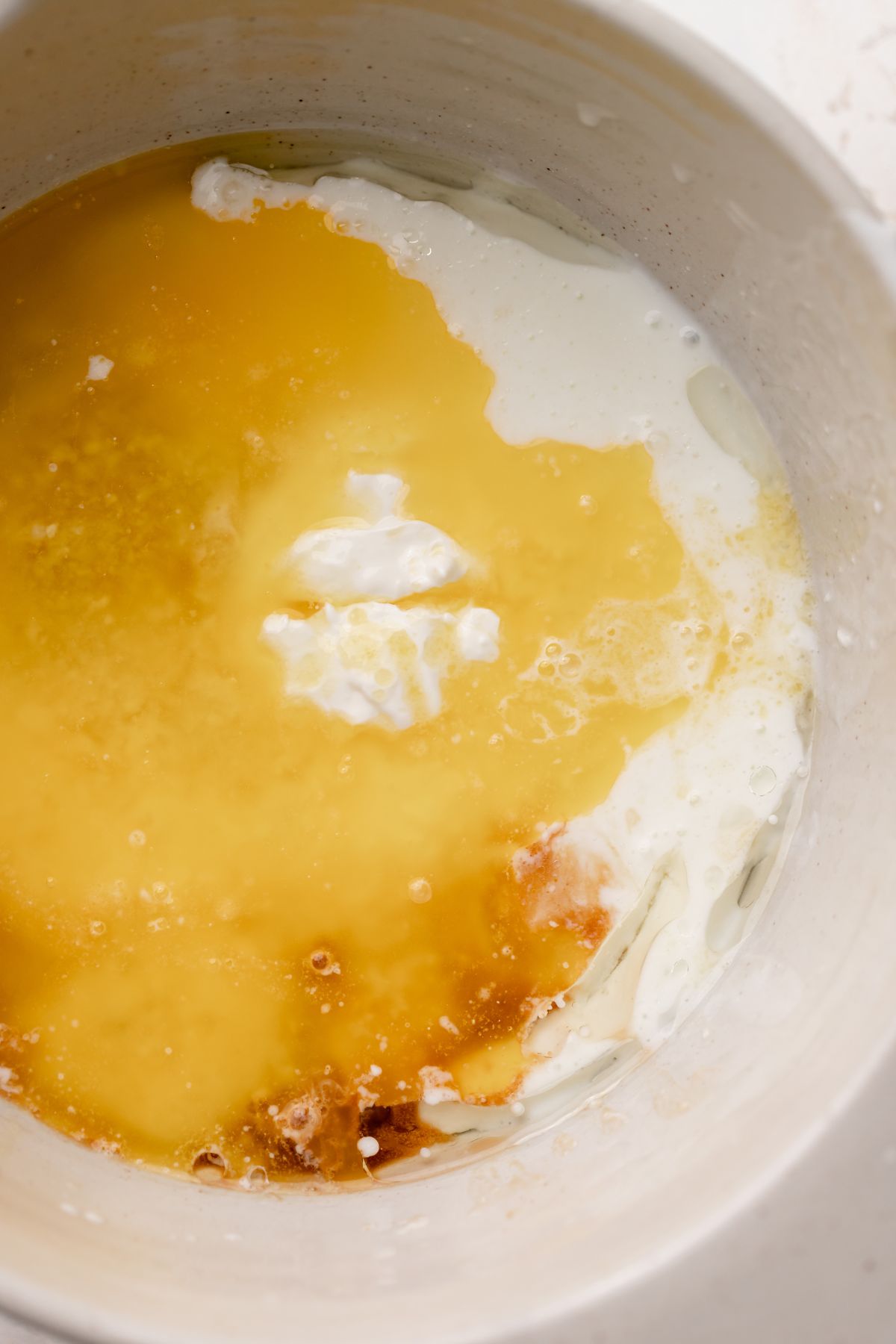 A bowl with the wet ingredients before whisking.