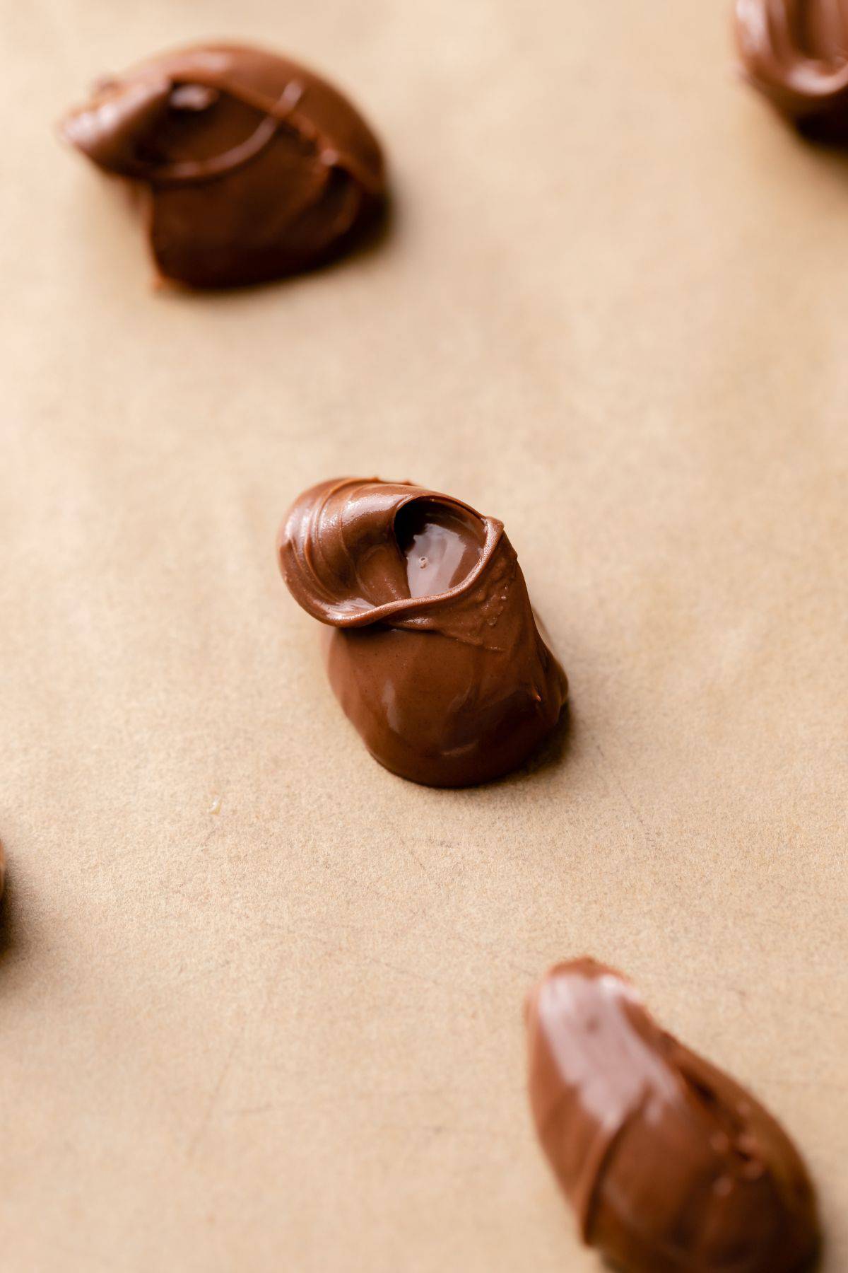 Scoops of nutella on a baking sheet.