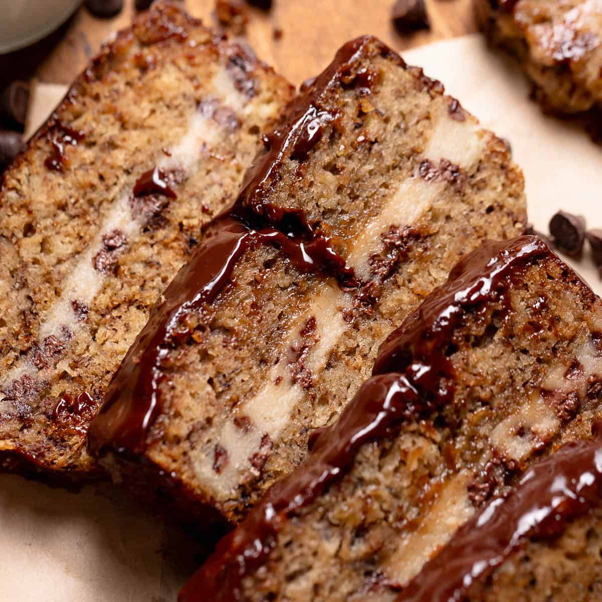 Slices of banana bread on parchment paper.