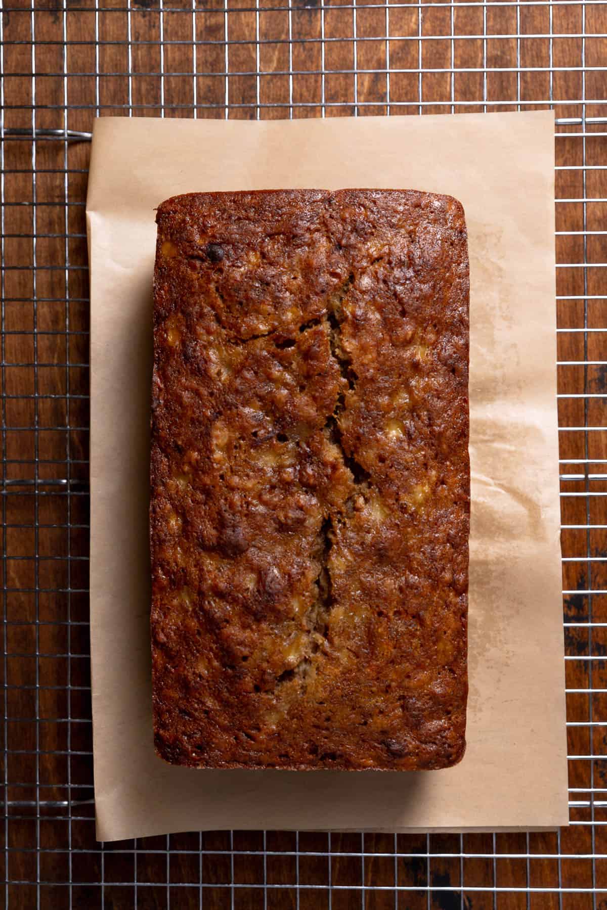 Baked banana bread cooling on a wire rack.