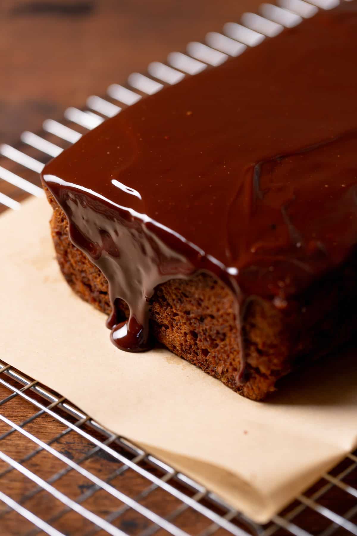 Banana bread with the chocolate glaze poured over the top.