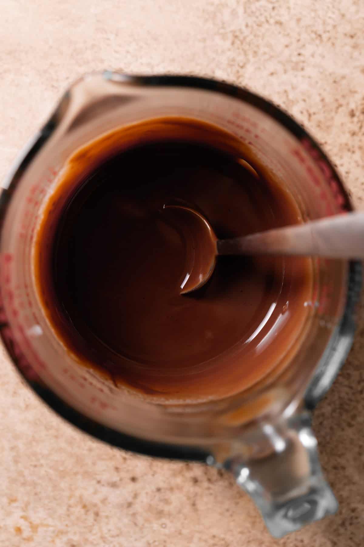 A mixing bowl with the chocolate glaze.