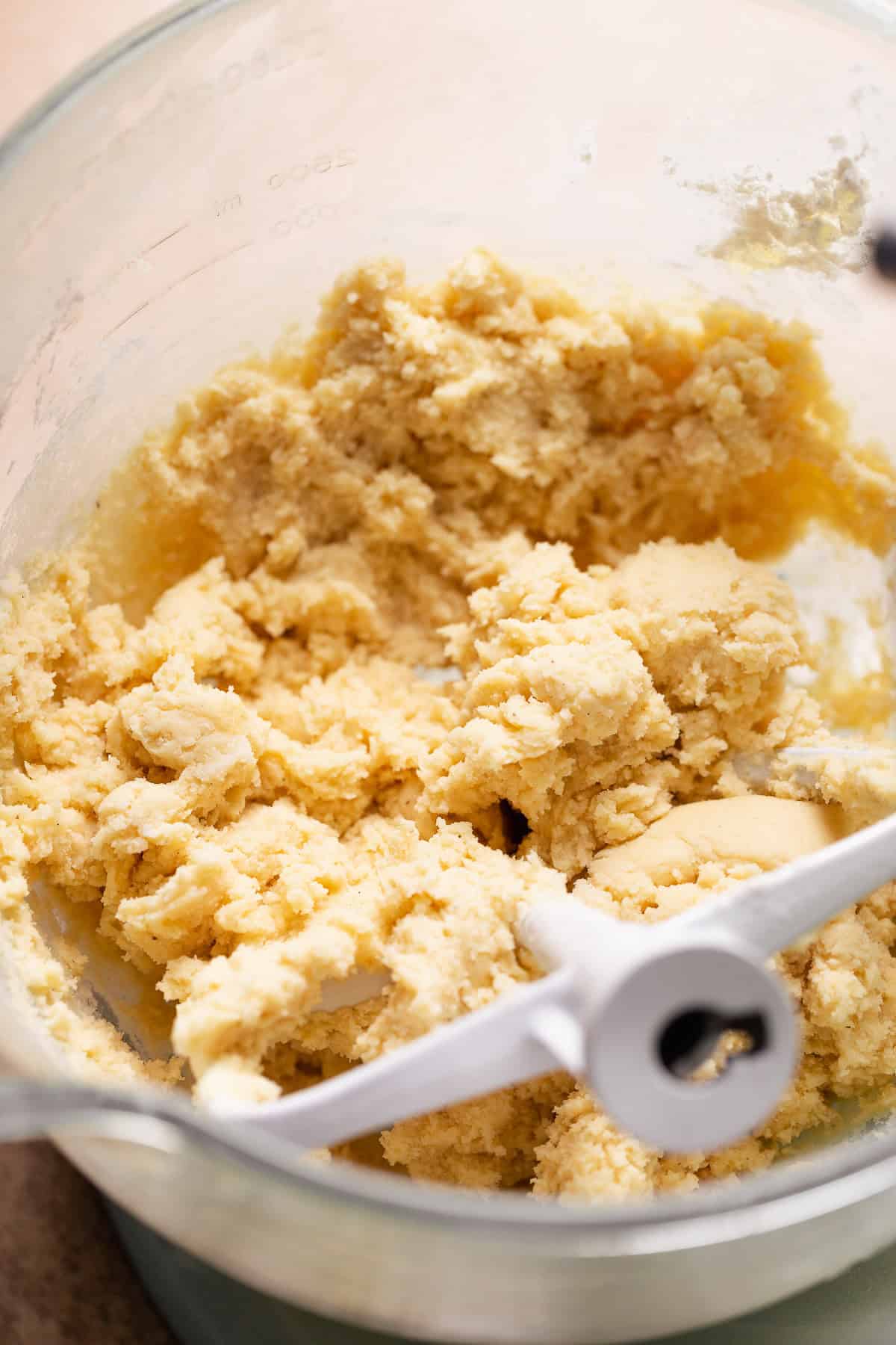 Sugar cookie dough in a mixing bowl.