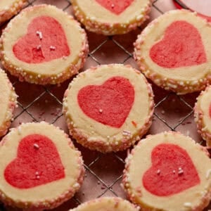 Valentine's heart cookies on a wire rack.