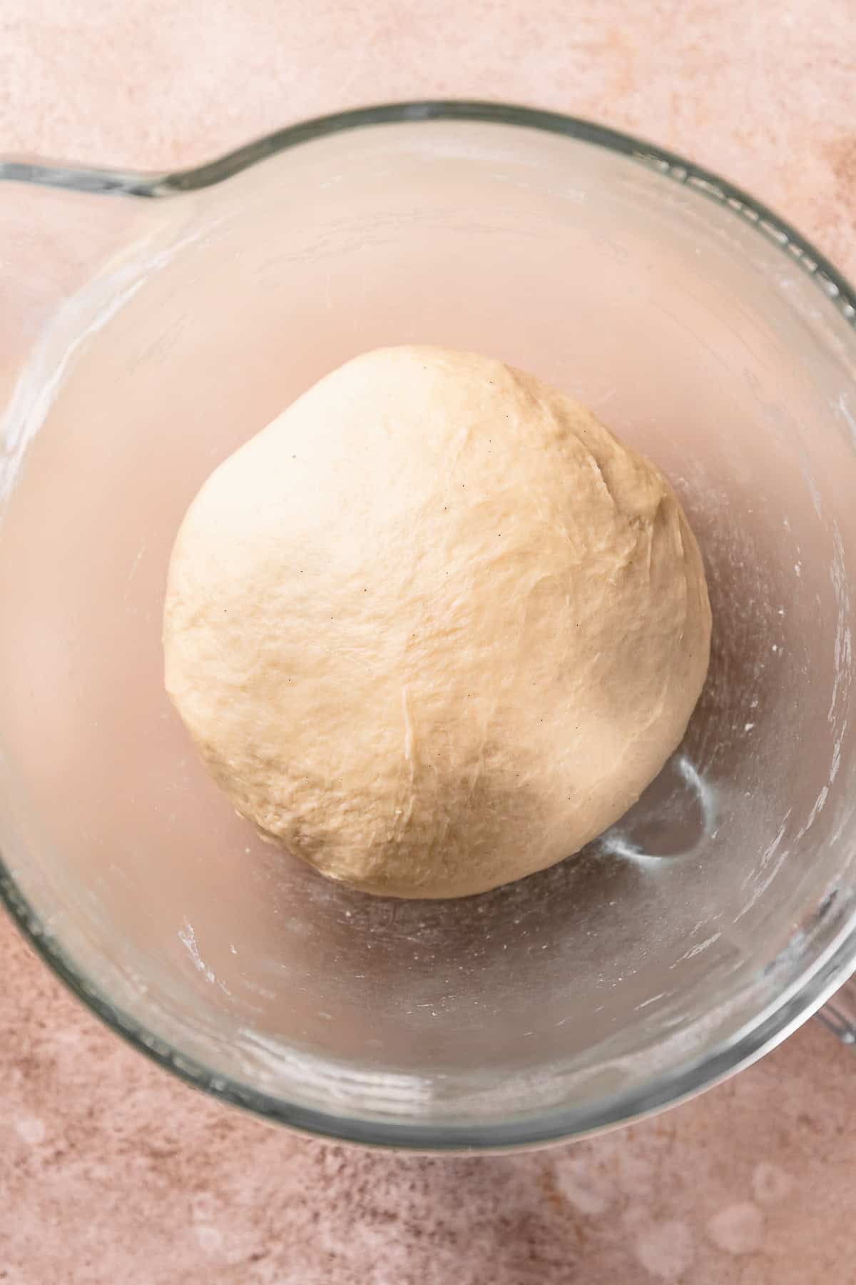 The kneaded dough ball resting in a mixing bowl.