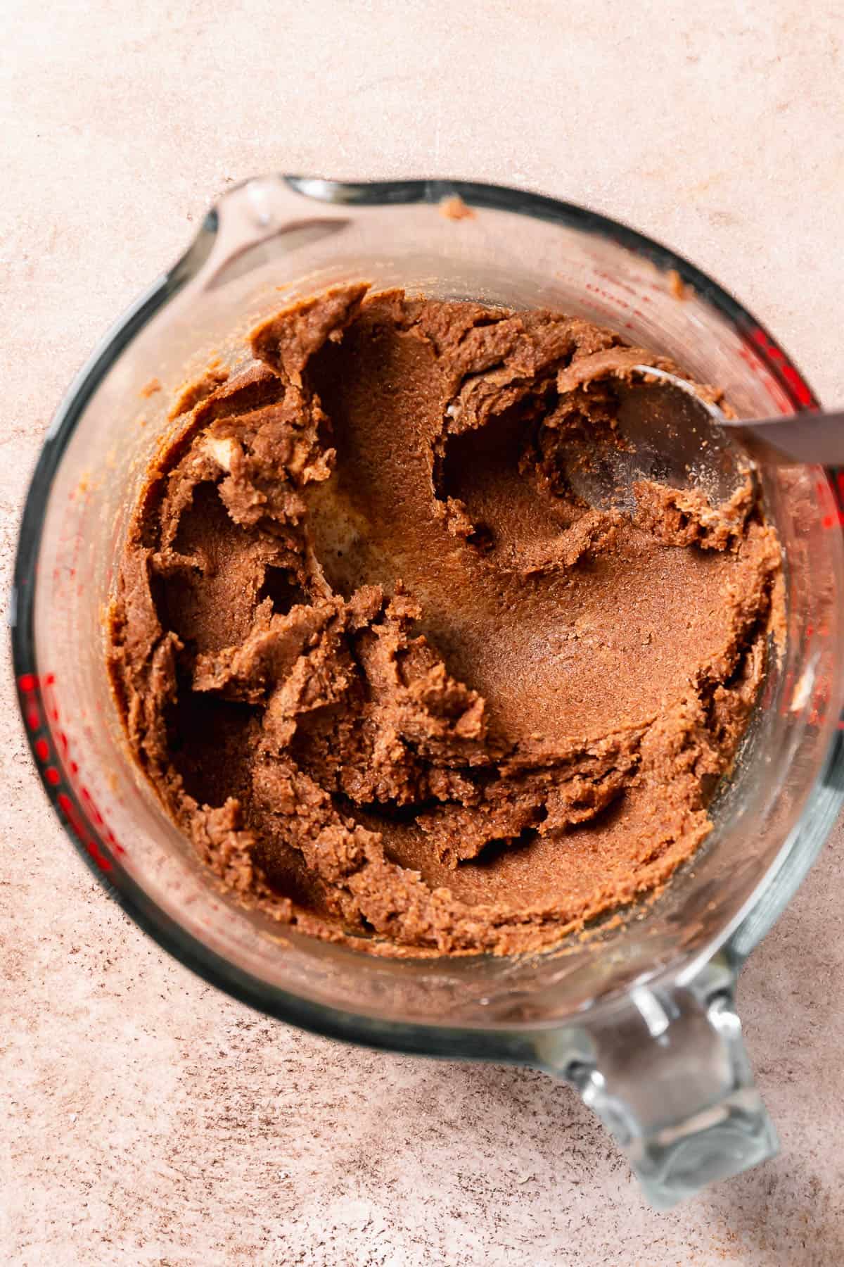 Brown sugar cinnamon filling mixed together in a glass bowl.