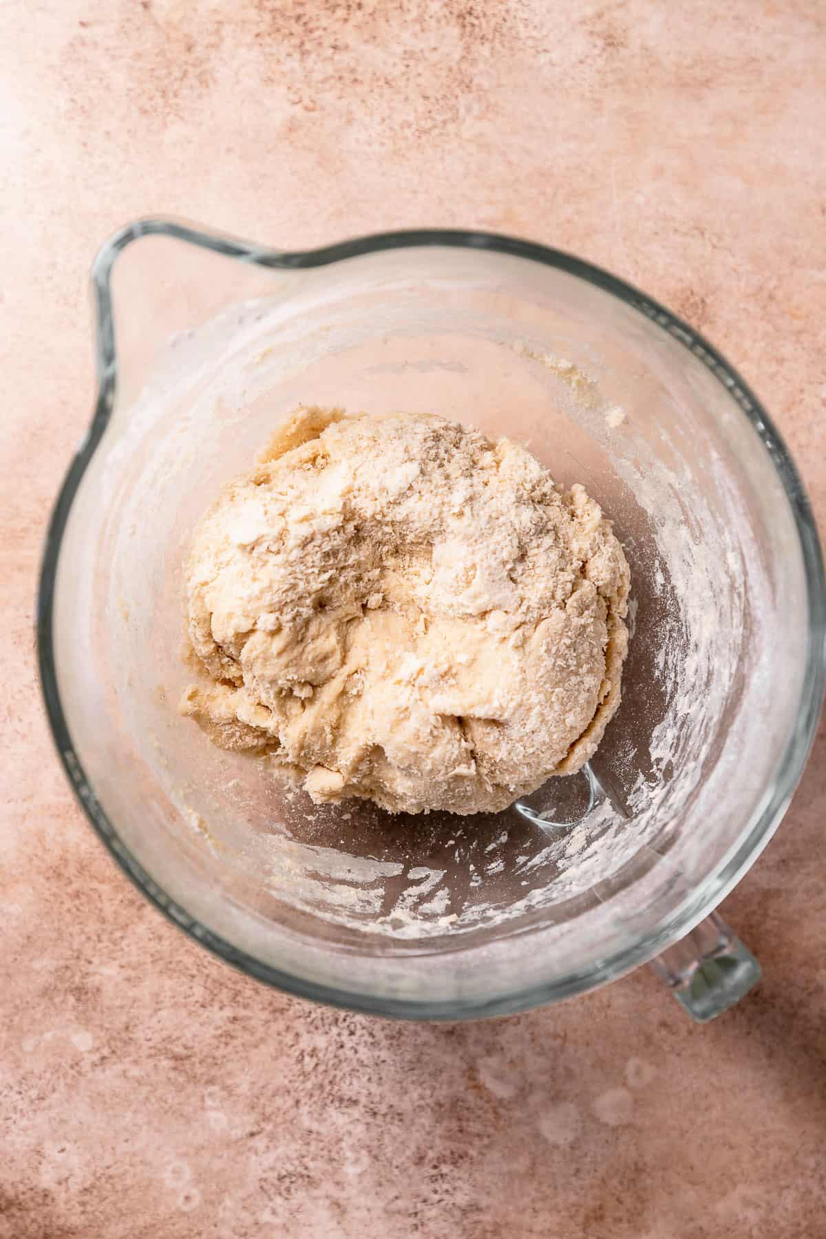 A rough dough ball in a mixing bowl.