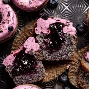 Blueberry cupcake cut in half to show the filled centers.