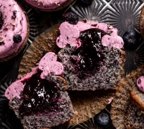 Blueberry cupcake cut in half to show the filled centers.