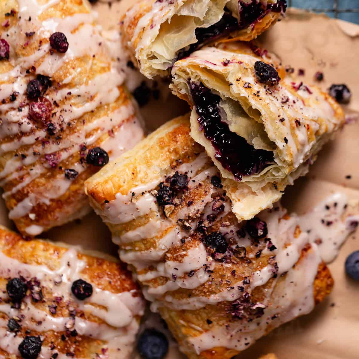 Toaster pastries with blueberry filling on parchment paper.