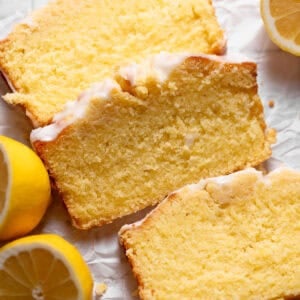 Slices of lemon cake on white parchment paper.