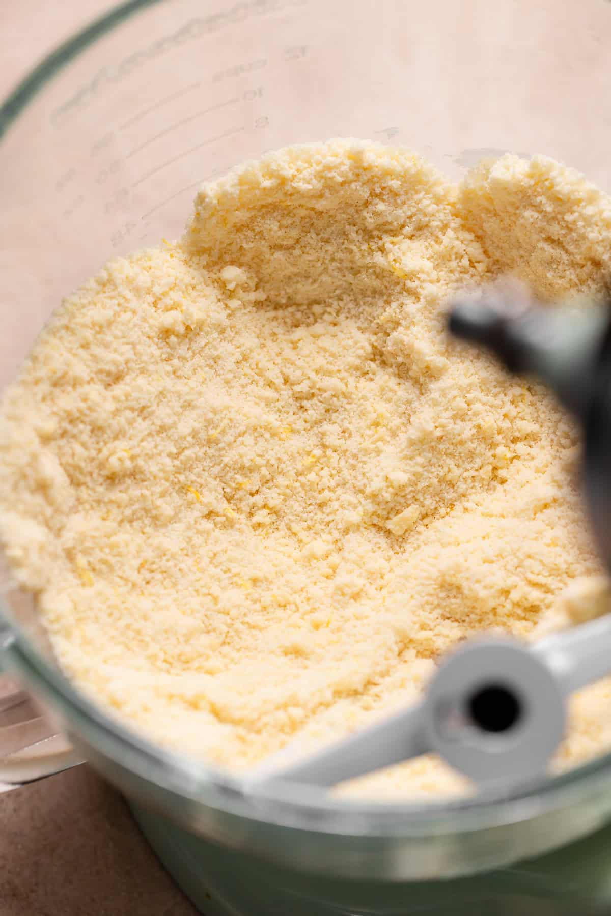 A mixing bowl with the butter mixed into the dry ingredients.