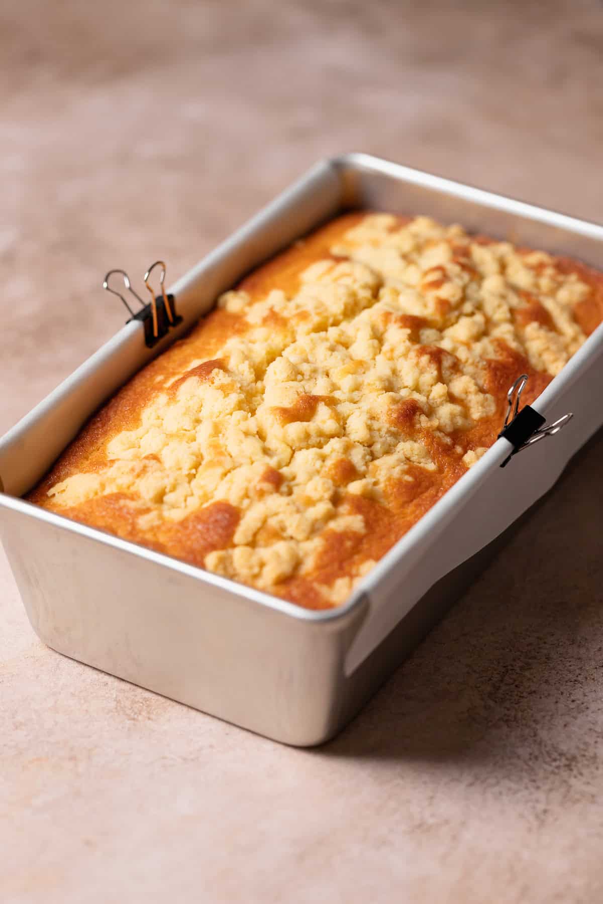 Lemon cake in a loaf pan after cooling.