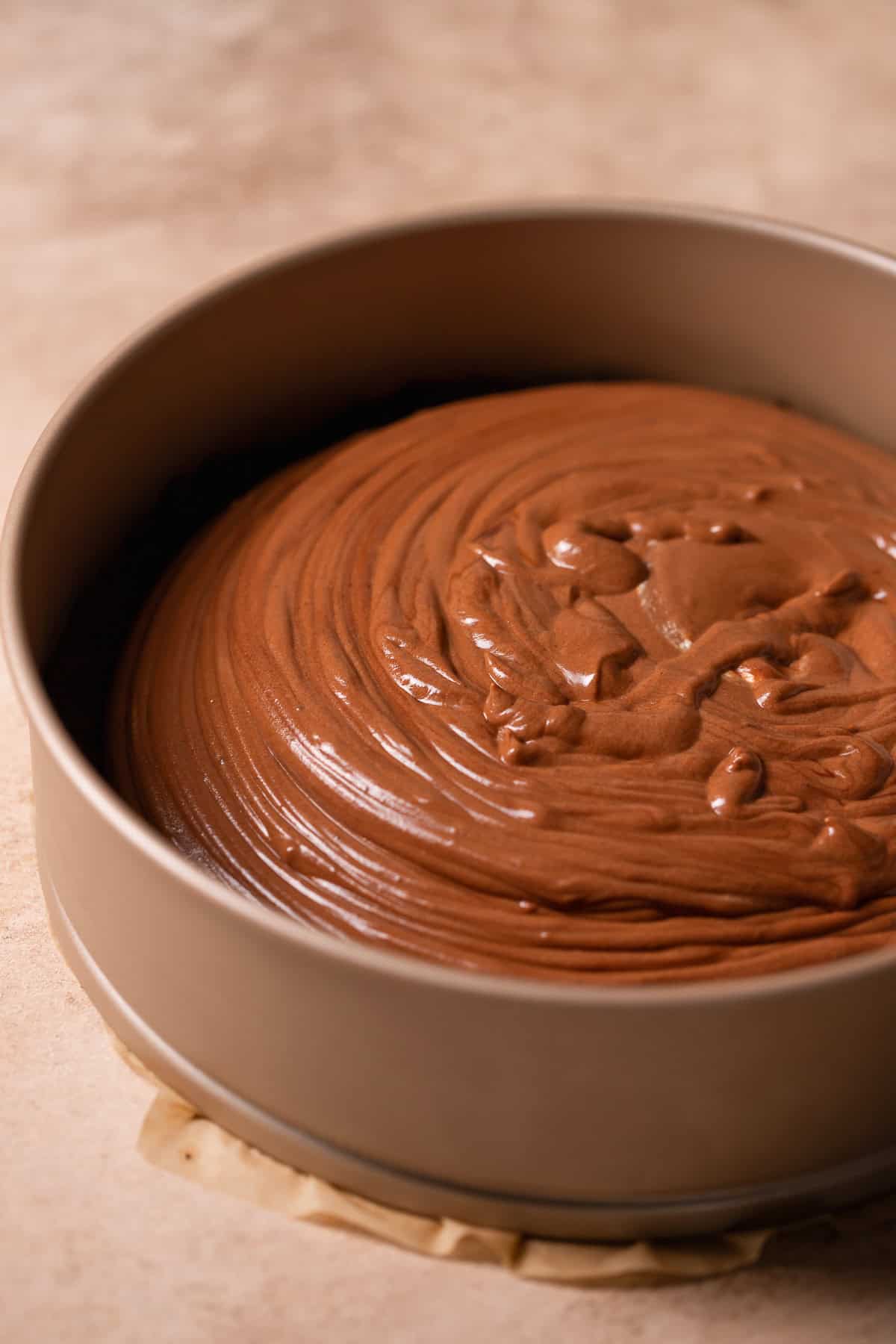 Chocolate mousse filling poured over the top of the Oreo crust.