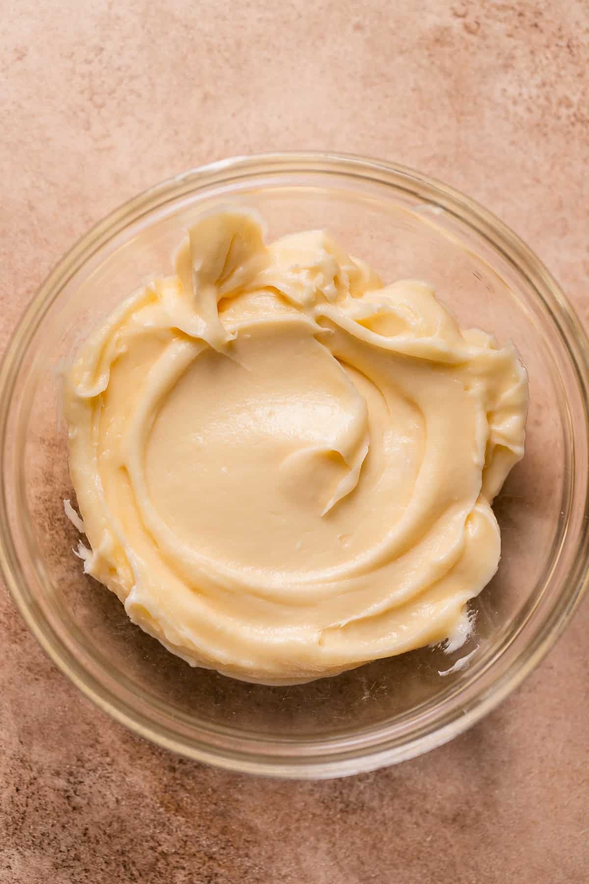 Cream cheese frosting in a bowl.