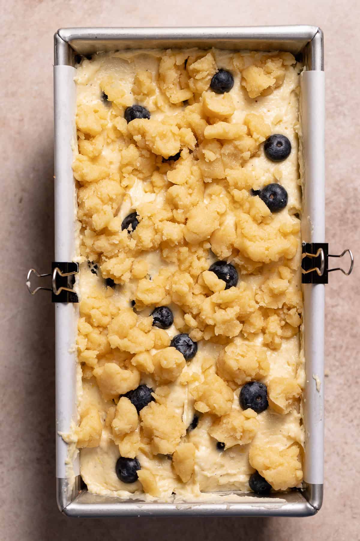The blueberry lemon loaf with crumble topping before baking.
