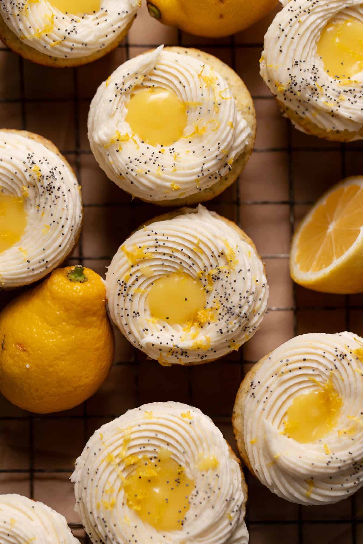 An overhead shot of the lemon cupcakes with lemon curd filling in the center of the frosting.