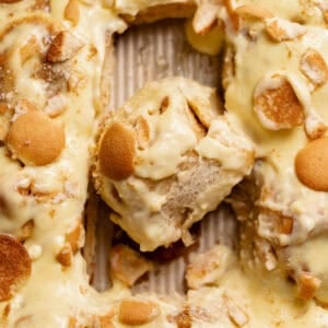 Banana pudding rolls in a baking pan.