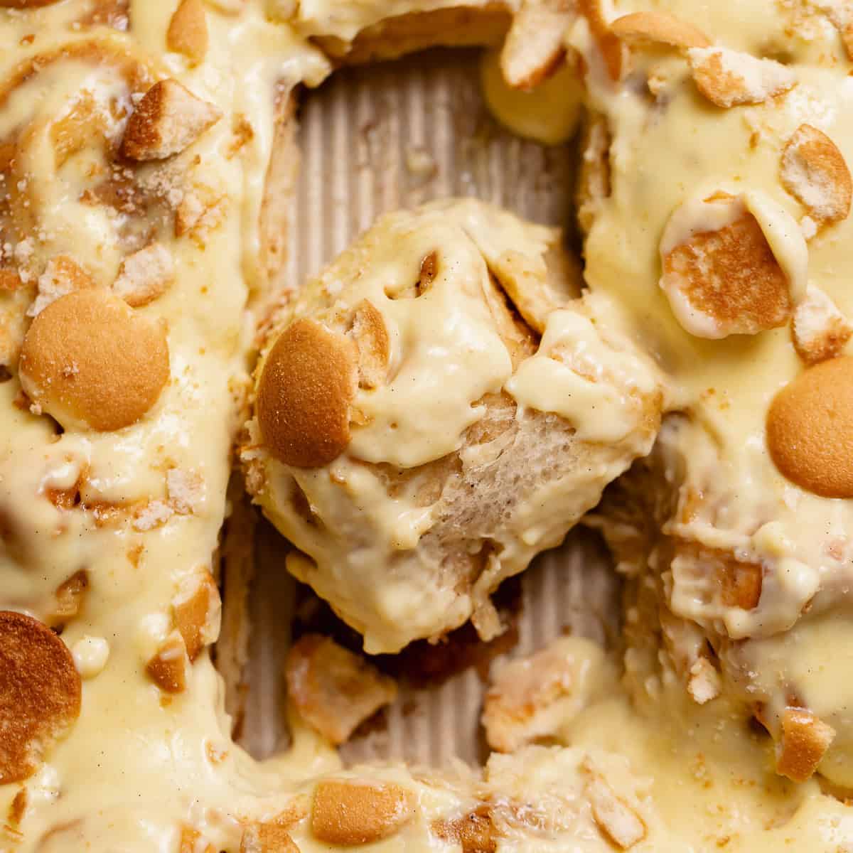 Banana pudding rolls in a baking pan.