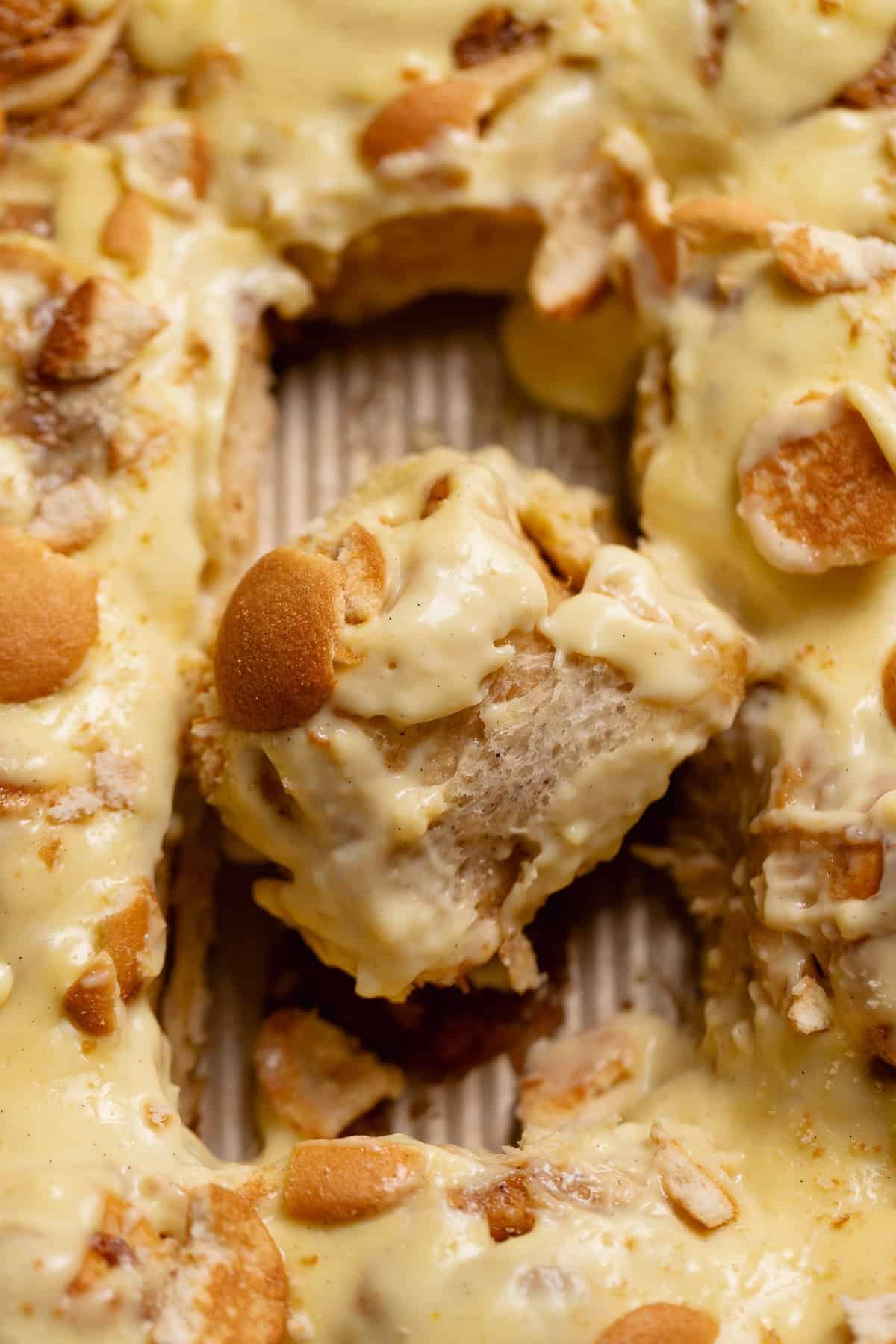 Banana pudding rolls in a baking pan.