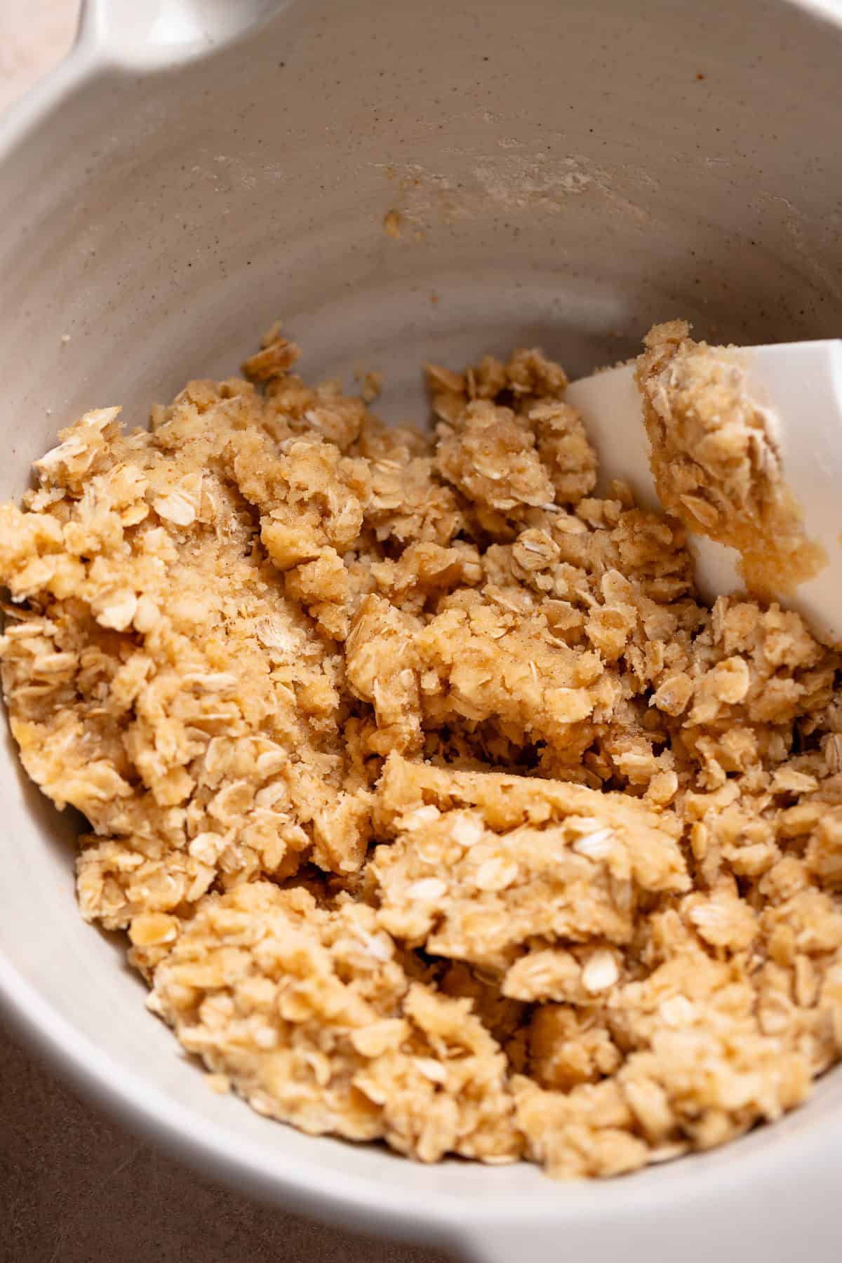 Brown sugar oat crumble dough in a bowl.
