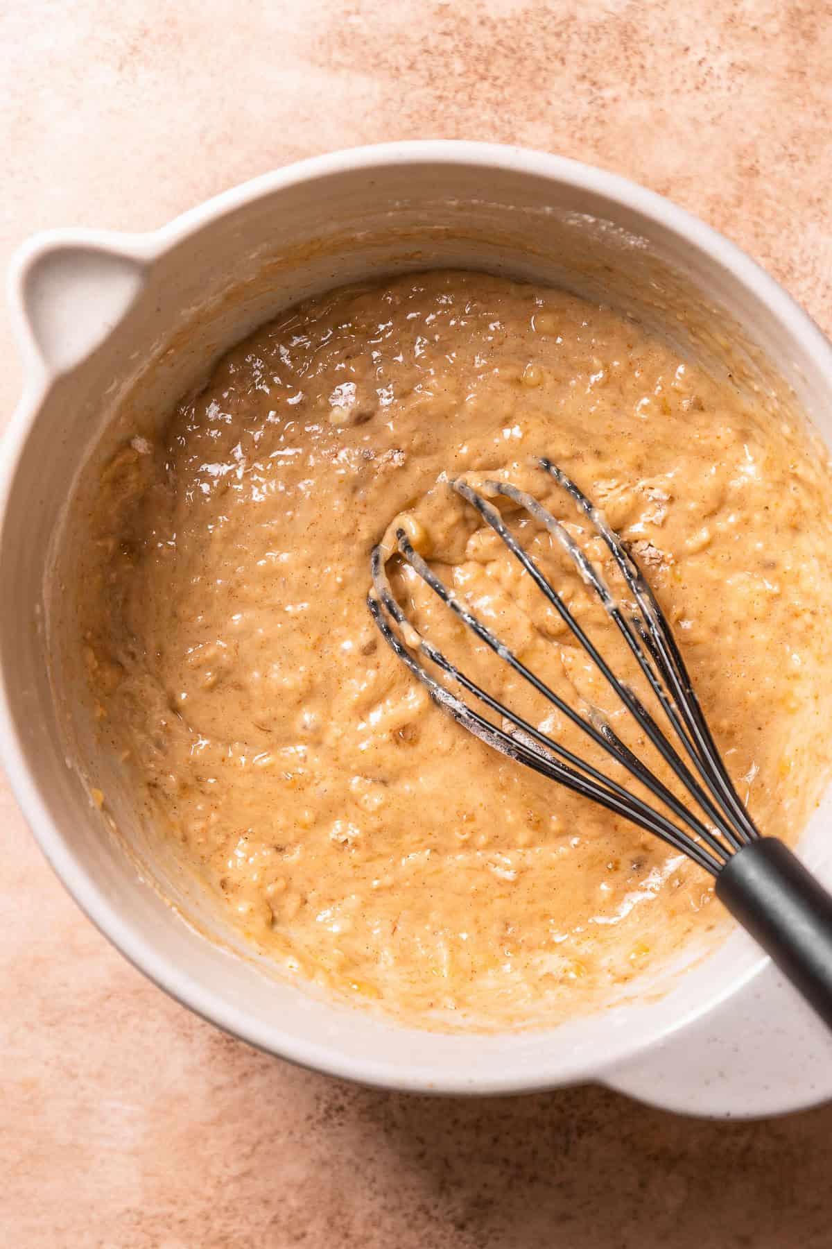 Brown butter banana bread batter in a mixing bowl.