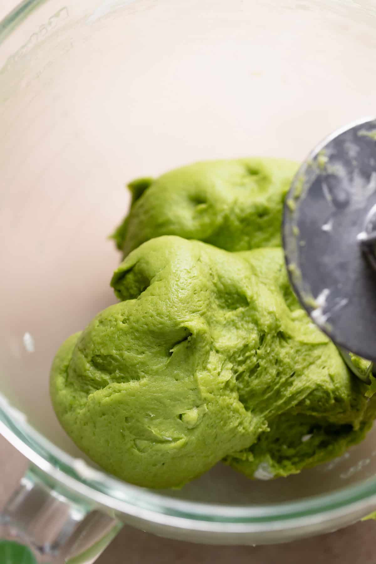 Soft matcha dough in a mixing bowl.