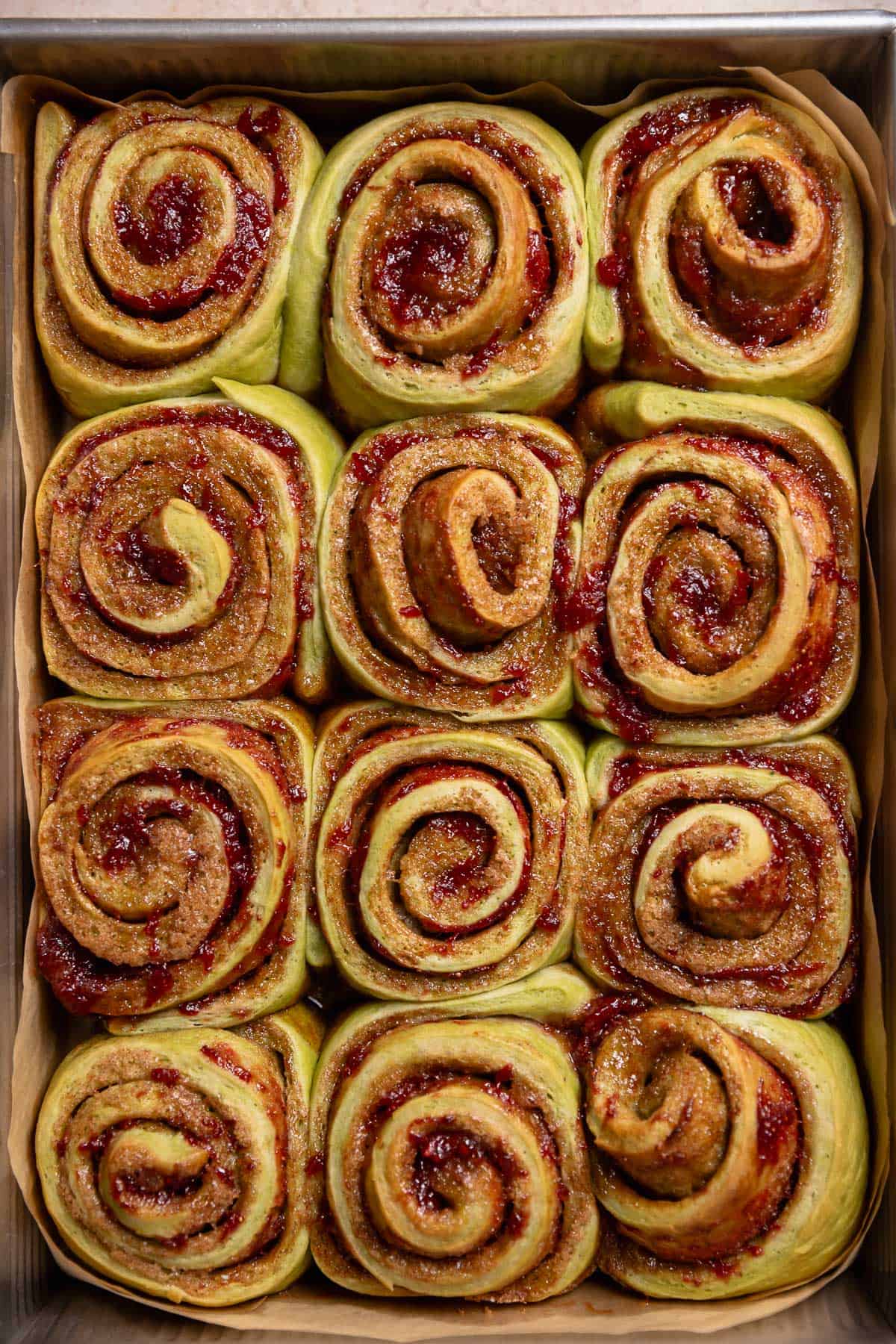 Baked cinnamon rolls in a pan.