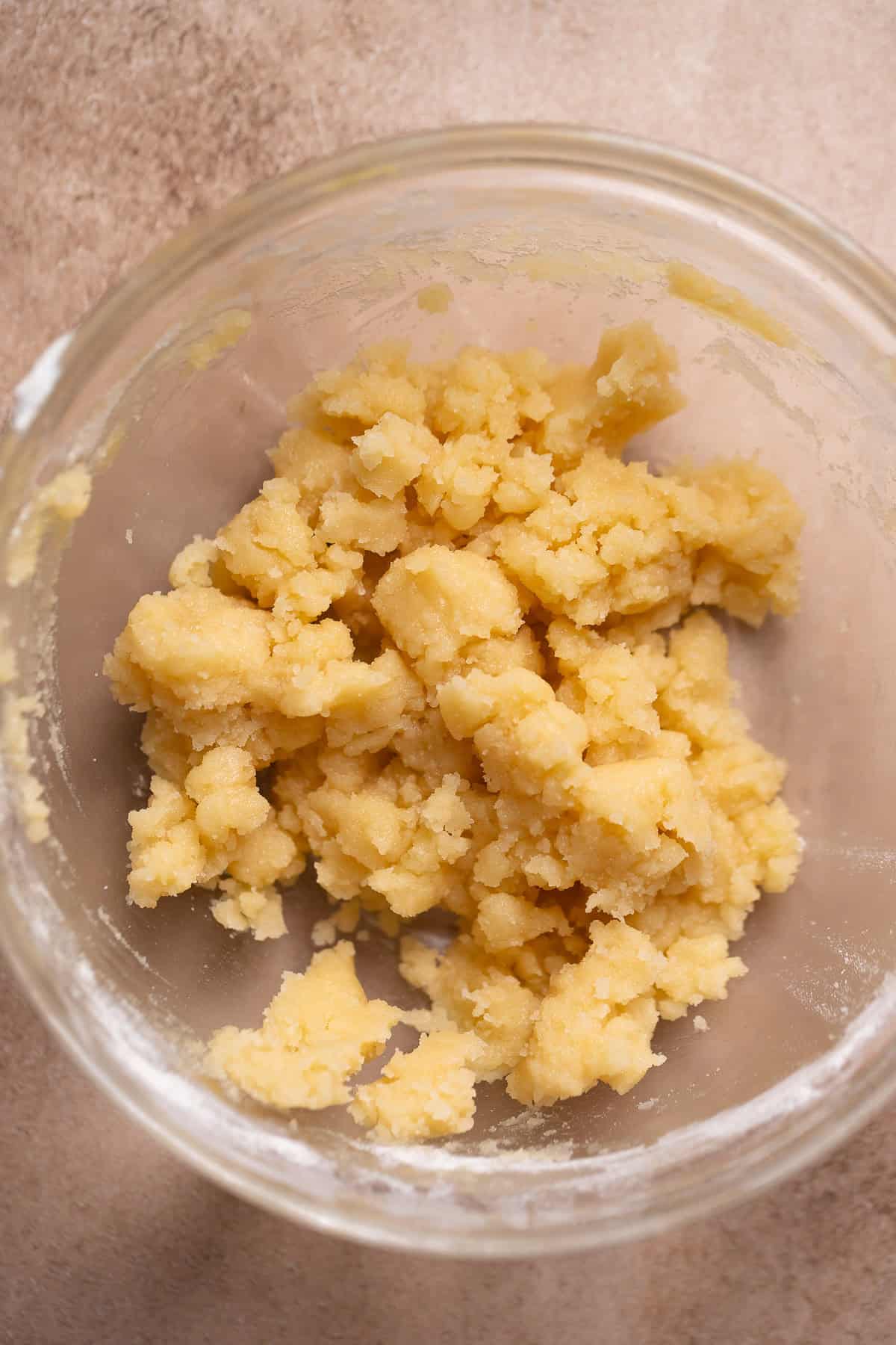 Crumb topping in a glass mixing bowl.