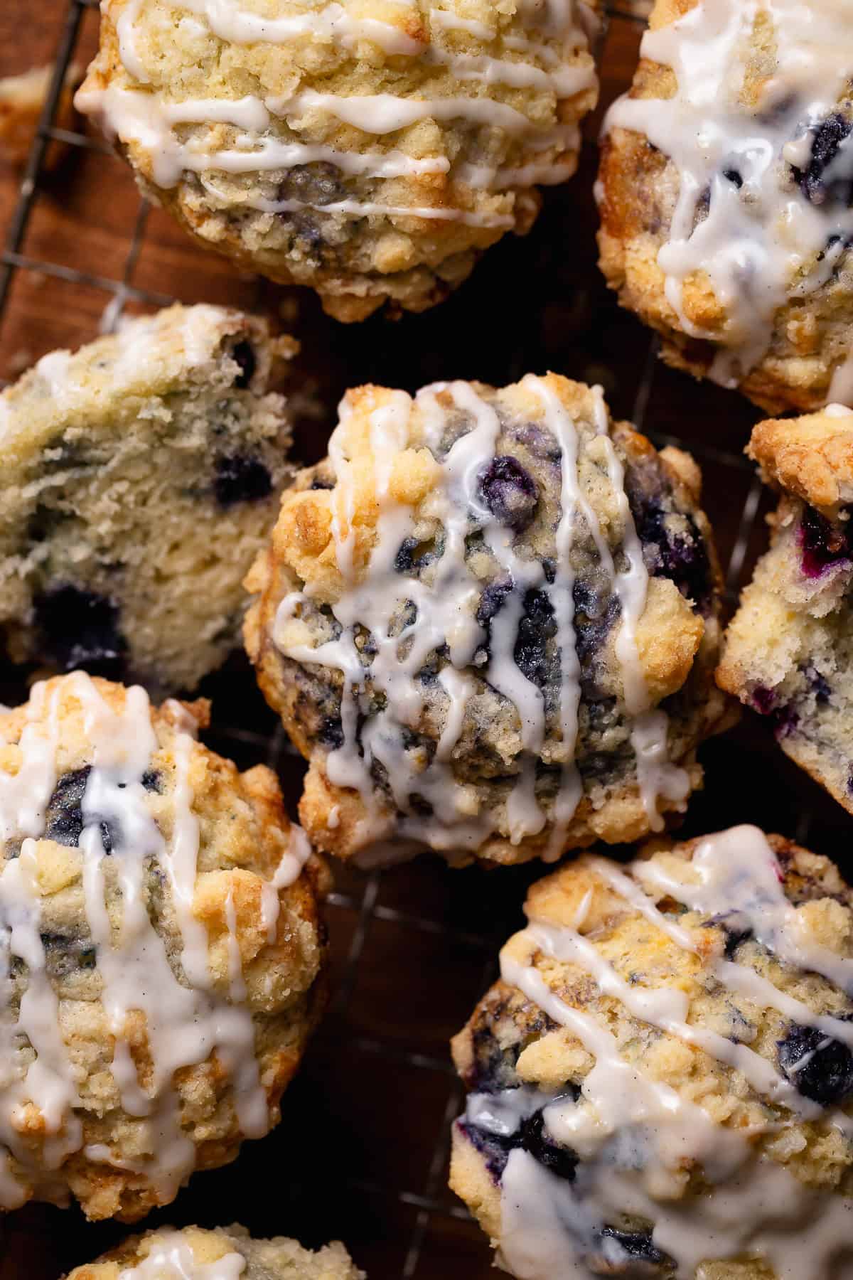 Crumb topped blueberry muffins with vanilla glaze.