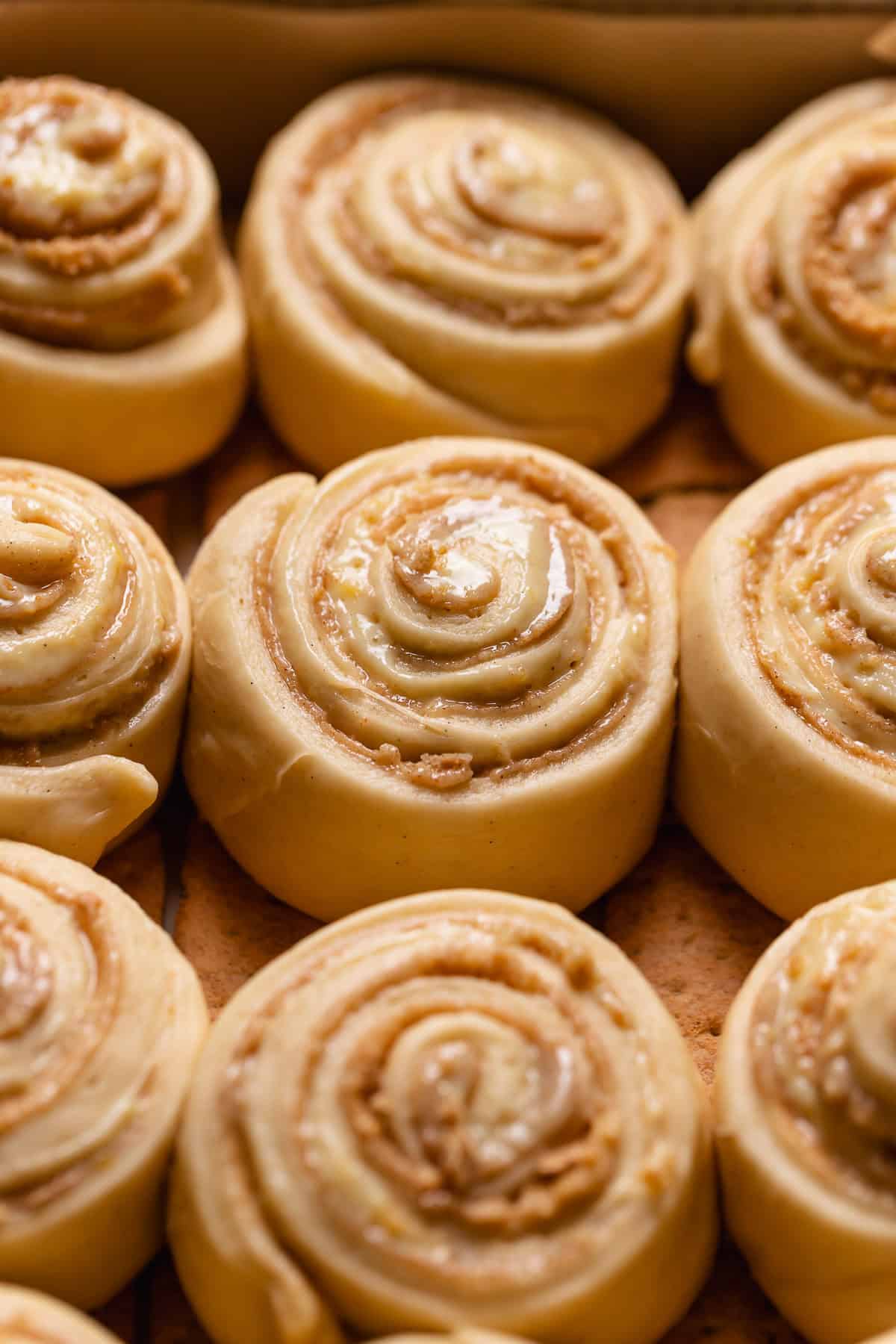 Key lime pie rolls in a baking pan barely touching before baking.