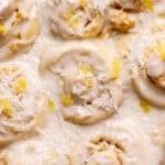 Pineapple coconut rolls in a baking pan.