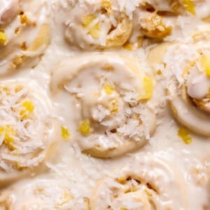 Pineapple coconut rolls in a baking pan.
