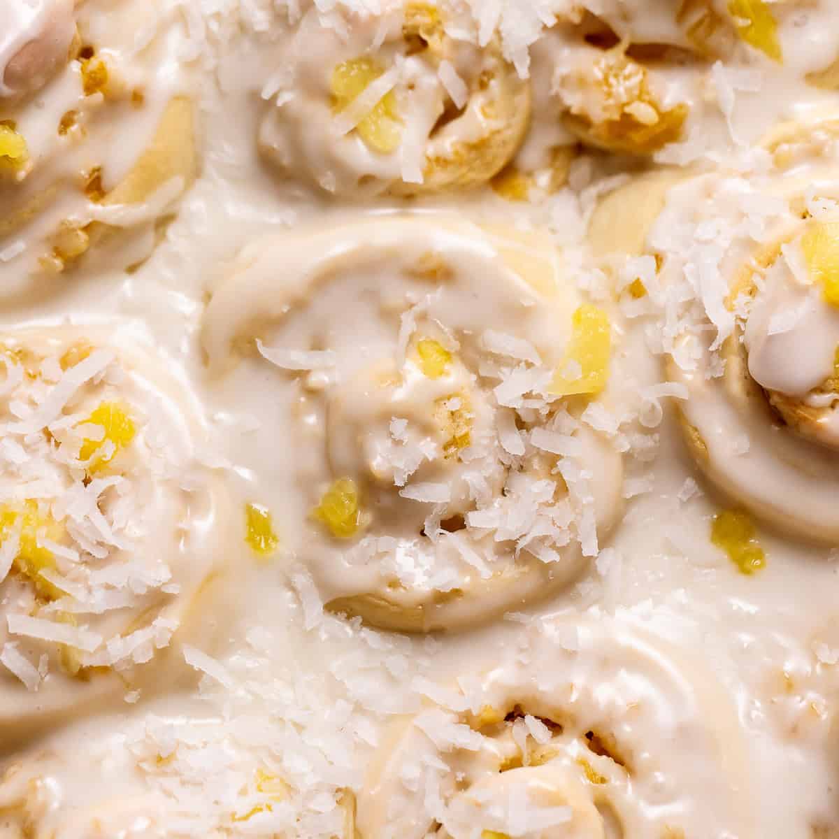 Pineapple coconut rolls in a baking pan.