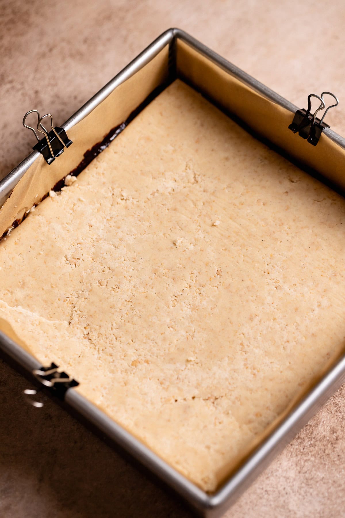 Unbaked smores bars in a metal baking pan.