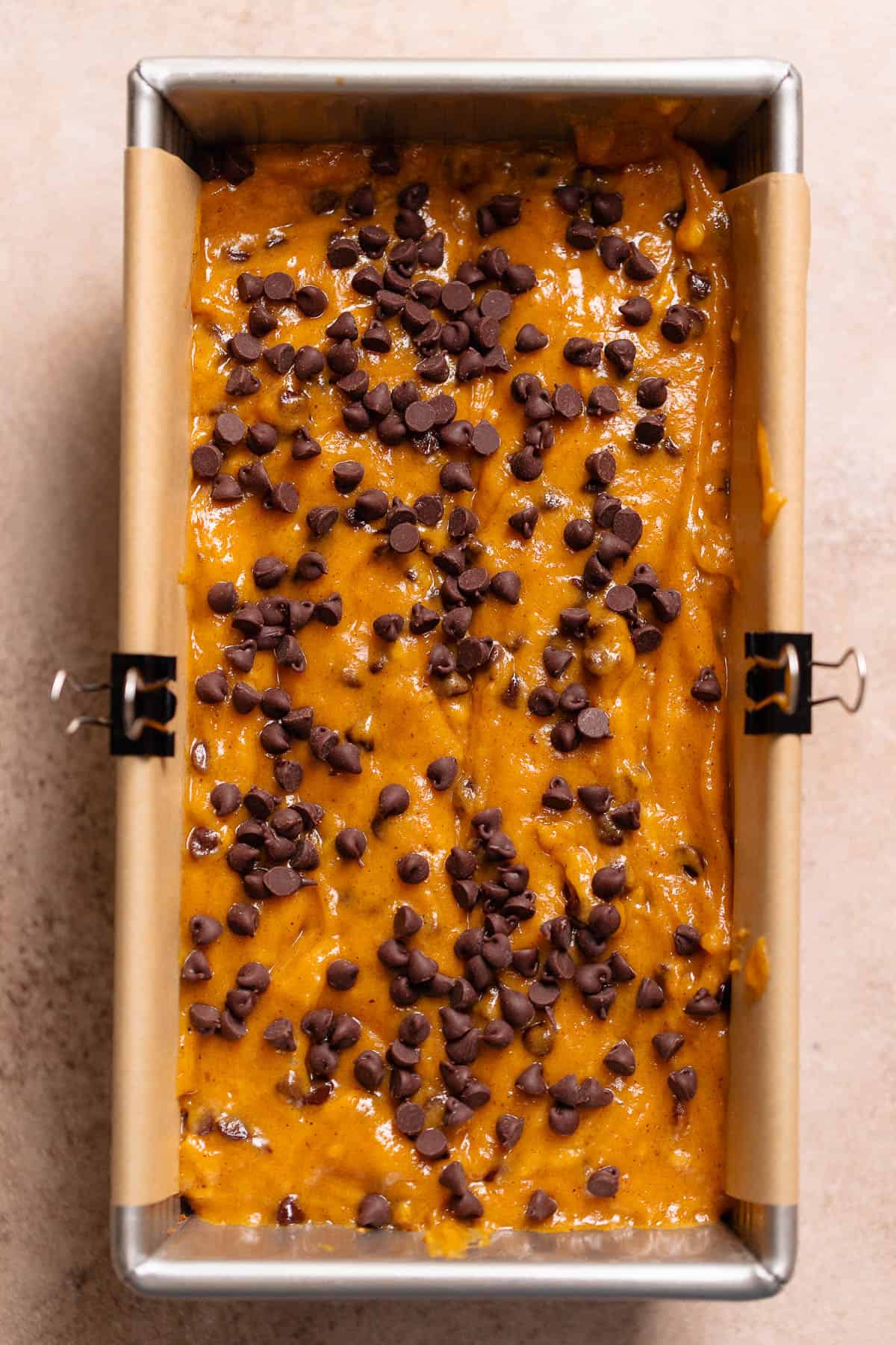 Chocolate chip pumpkin bread batter in a loaf pan.