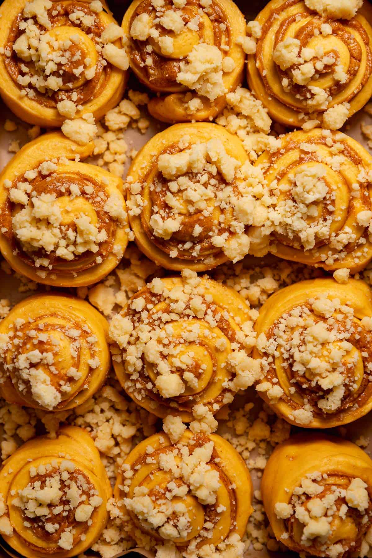 Pie crumb topped cinnamon rolls before baking.