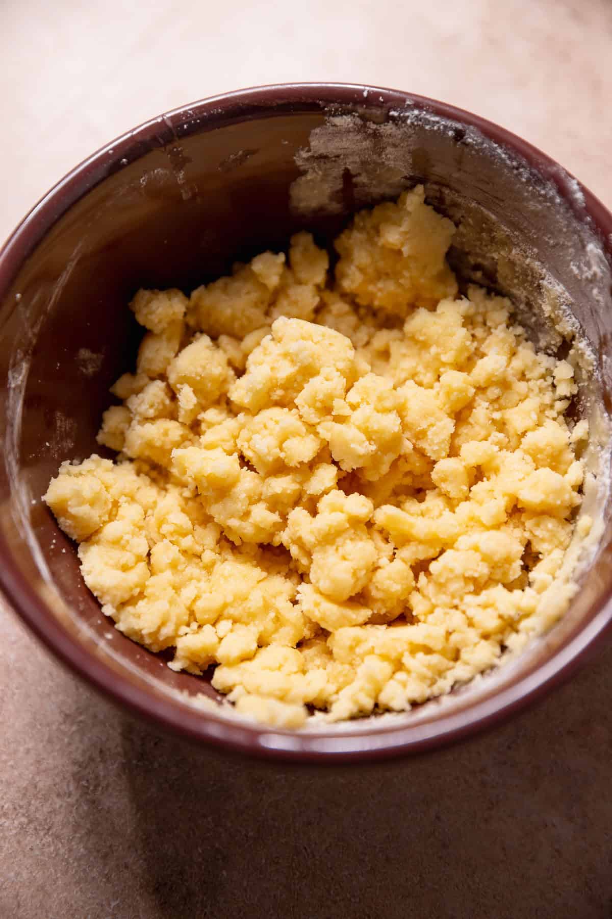 Pie crumbs in a purple bowl.