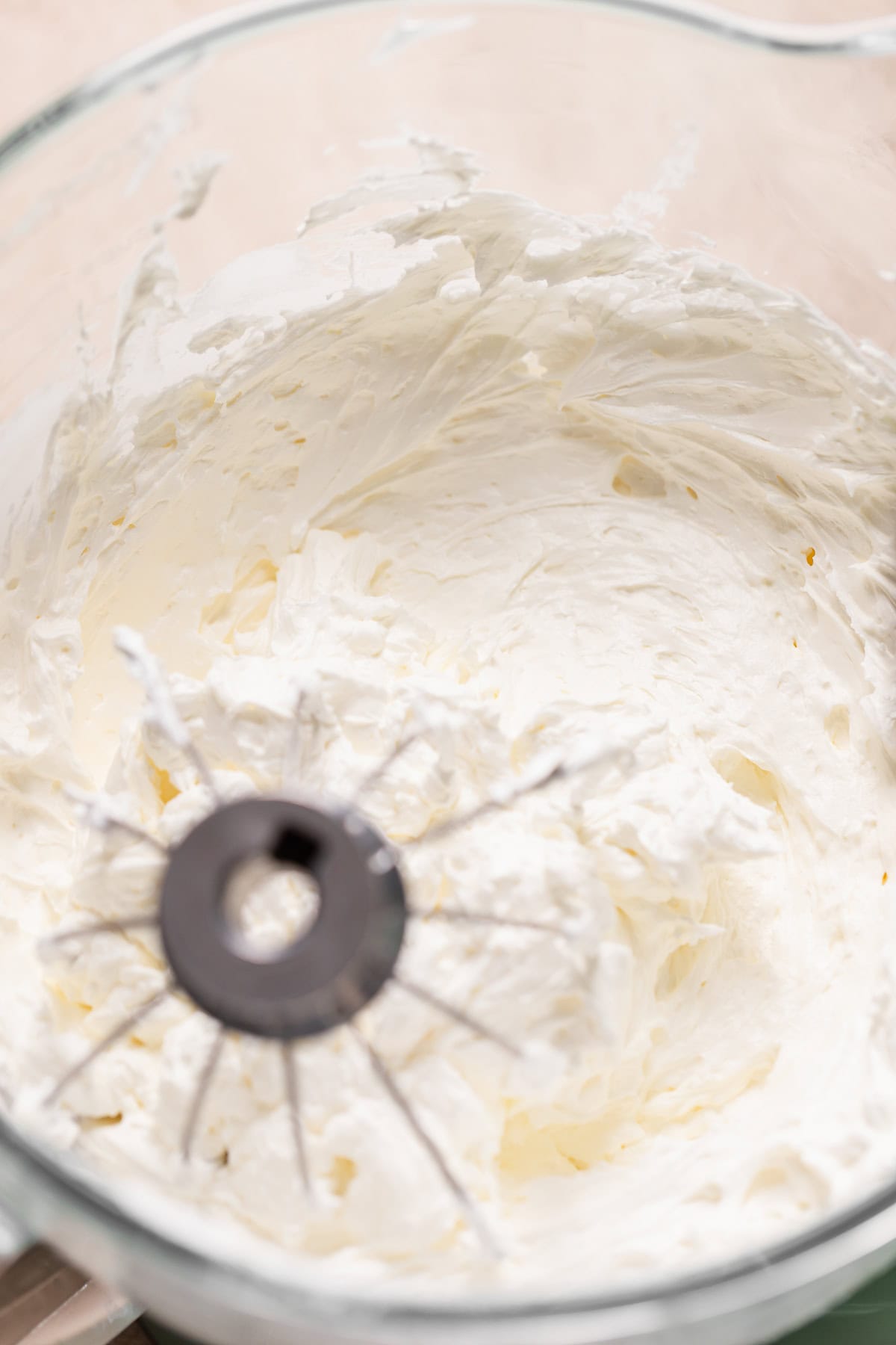 Vanilla Swiss meringue buttercream whipped smooth in a mixing bowl