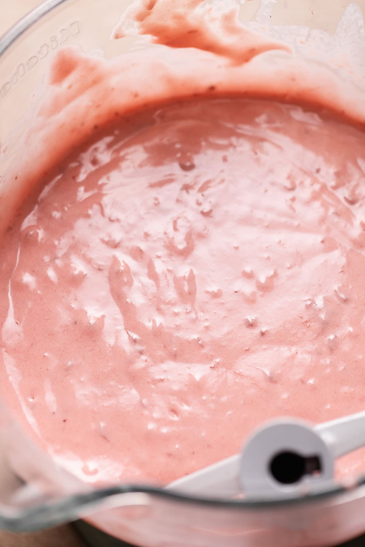 Fresh strawberry cake batter mixed in a bowl.