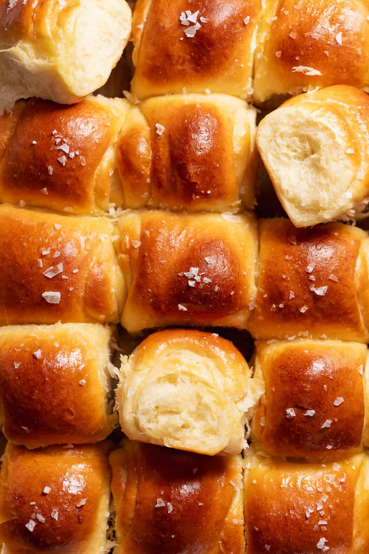 Close-up of a soft fluffy dinner roll showing its light airy pull-apart interior.