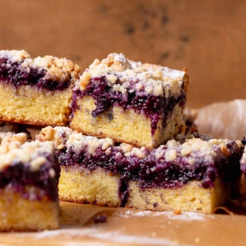 Blueberry crumble cake with a moist vanilla cake and jammy baked blueberries.