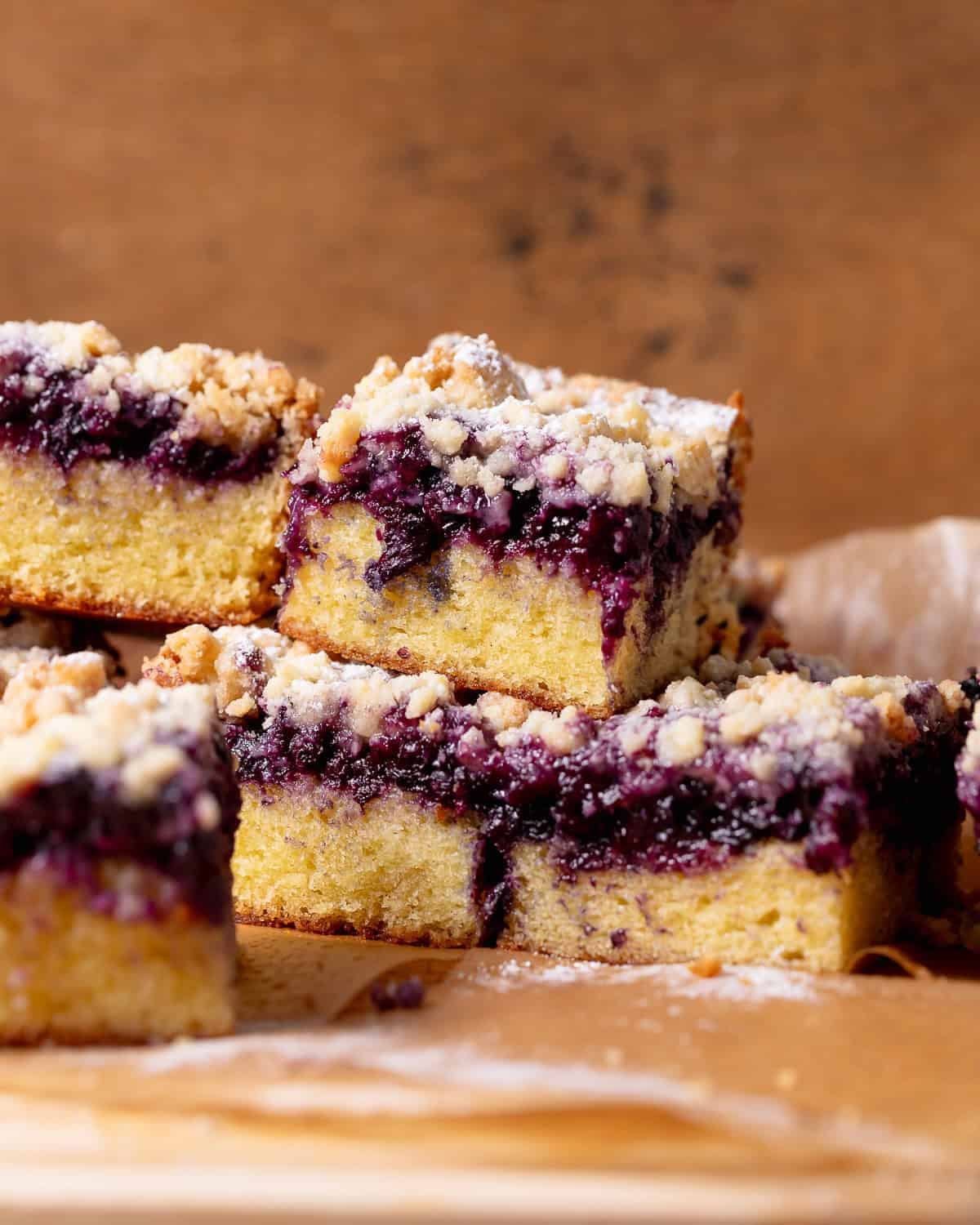 Blueberry crumble cake with a moist vanilla cake and jammy baked blueberries.
