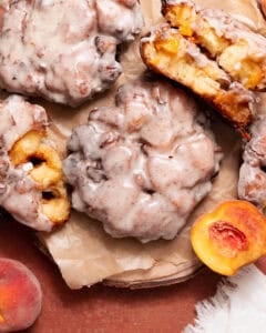 Peach fritters with brown butter glaze and fresh peach filling, including a cut-open fritter showing the fluffy interior.