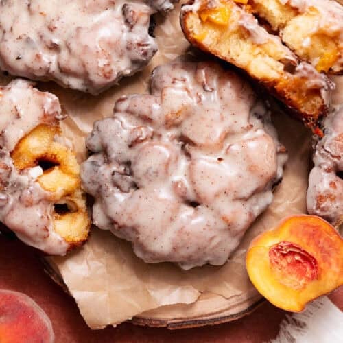 Peach fritters with brown butter glaze and fresh peach filling, including a cut-open fritter showing the fluffy interior.