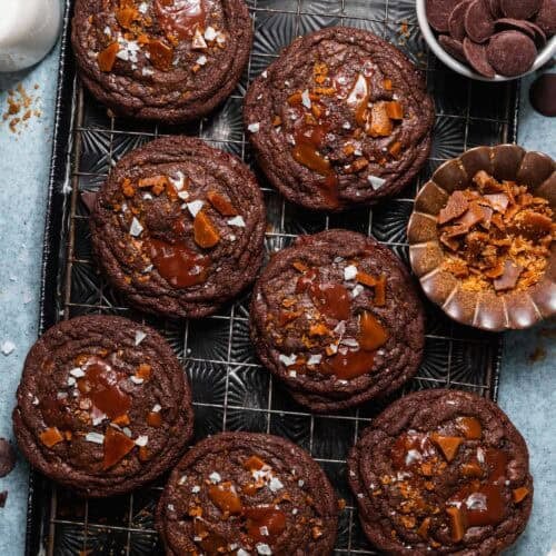 Double chocolate toffee cookies topped with melted chocolate, homemade toffee, and flaky sea salt.