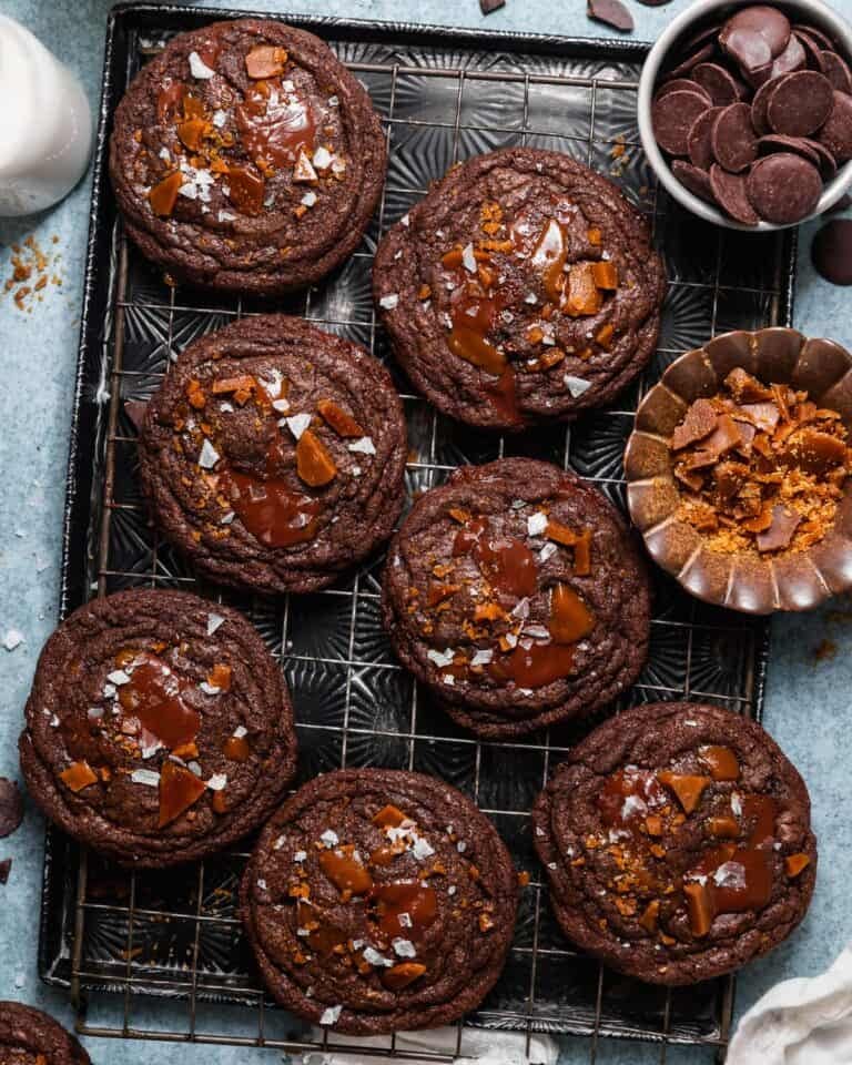 Double chocolate toffee cookies topped with melted chocolate, homemade toffee, and flaky sea salt.