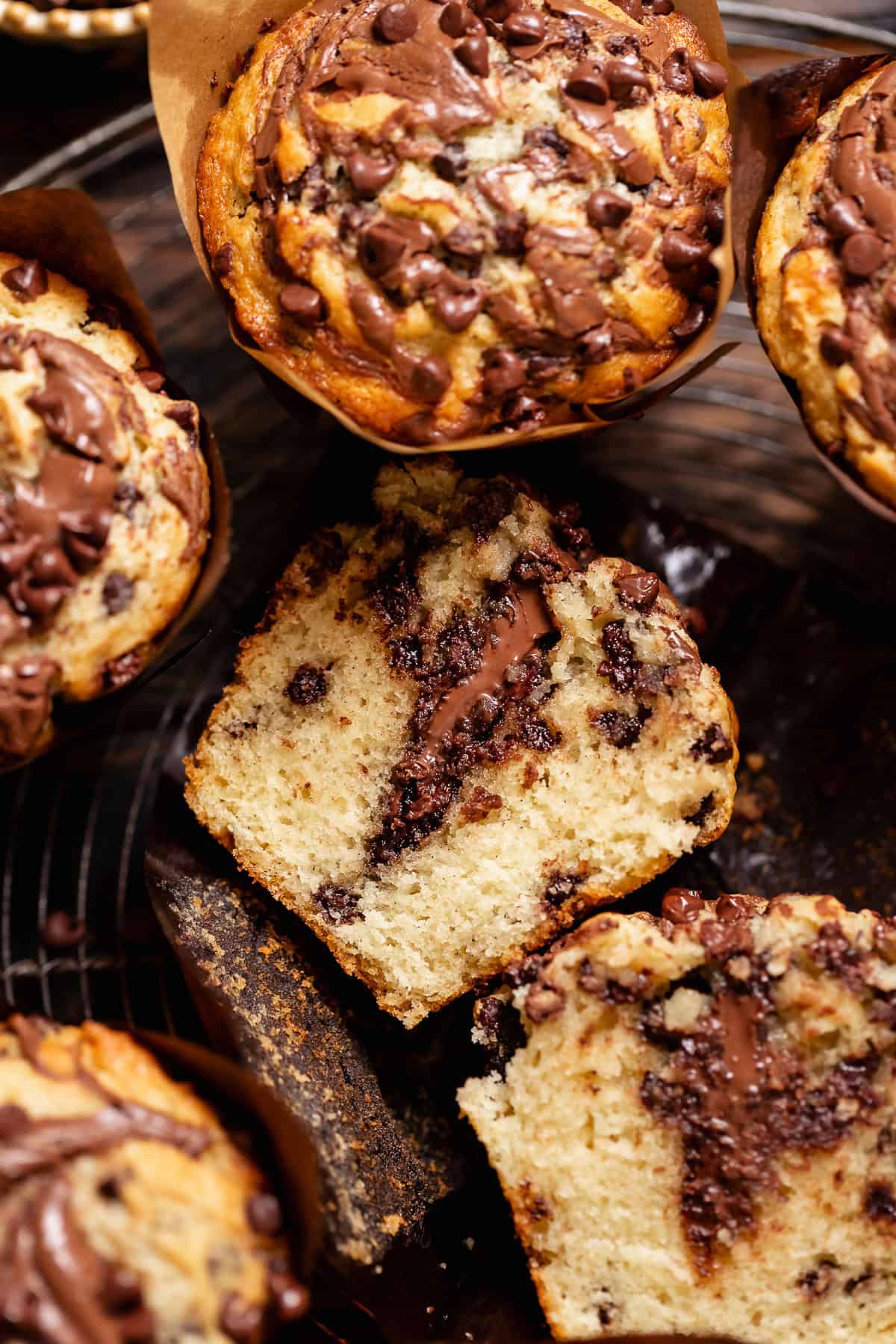 Chocolate Nutella muffin cut in half to reveal the melted Nutella center and soft crumb.