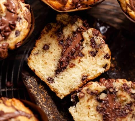 Chocolate Nutella muffin cut in half to reveal the melted Nutella center and soft crumb.