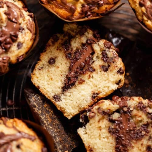 Chocolate Nutella muffin cut in half to reveal the melted Nutella center and soft crumb.
